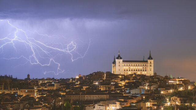 Picturesque cityscape with aged castle in night time