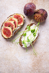 fig sandwich, cream cheese healthy breakfast fresh portion ready to eat meal snack on the table copy space food background rustic. top view keto or paleo diet veggie vegan or vegetarian food