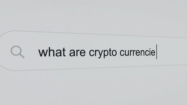 What are crypto currencies? - Pc screen internet browser search engine bar typing future related question.