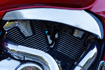 Closeup detail photo chrome engine and exhaust pipe of the motorcycle