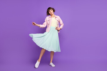 Full body photo of young happy nice charming woman good mood wear fly skirt isolated on violet color background