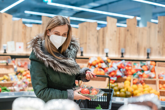 Woman Wearing Ffp2 Face Mask Shopping Groceries In Supermarket