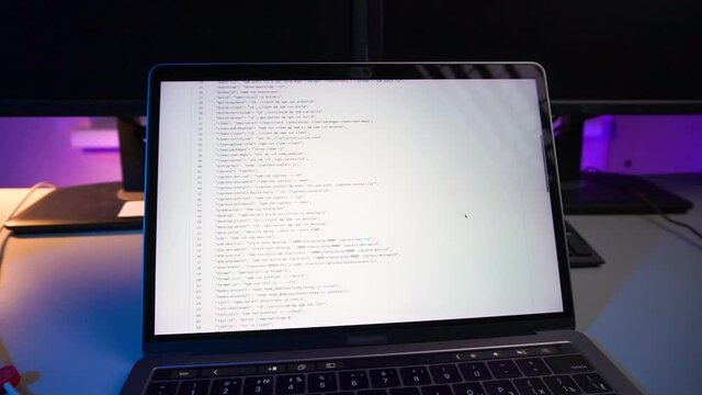 Computer code running over screen of laptop