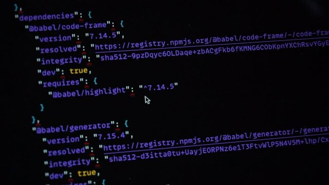Computer blue code running over black screen of laptop