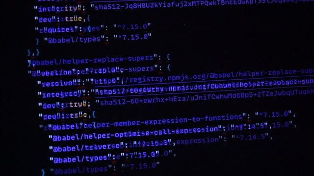 Computer blue code running over black screen of laptop