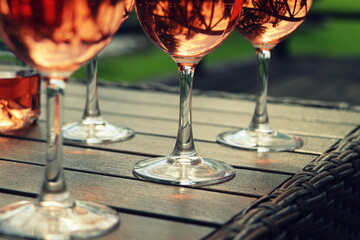 Composition with rose wine glasses , dark backgound