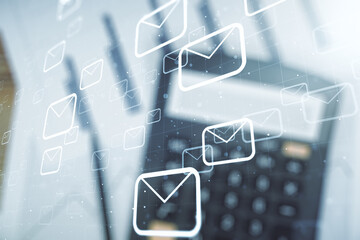 Double exposure of abstract virtual postal envelopes hologram on blurry calculator background. Electronic mail and spam concept