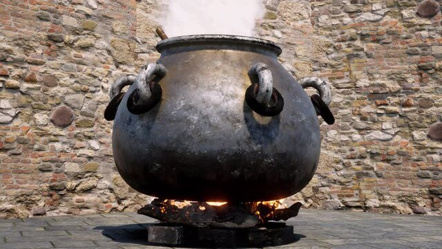 A close-up view of a large, old and rusty witch's cauldron brewing up a witch's magic potion.
