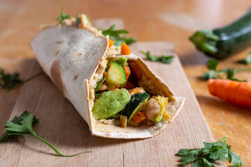Vegan burrito with chickpeas, zucchini, carrots and avocado