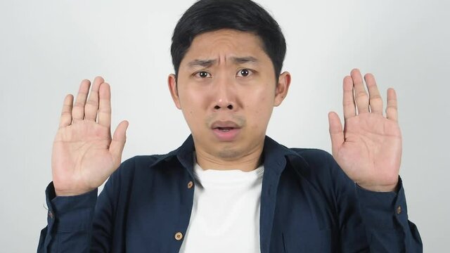 Man show hands up gesture surrender feeling scared portrait