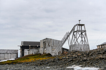 Russian research and polar expedition base in Tikhaya Bay (Tikhaya Bukhta) on Franz Josef Land archipelago. Wooden buildings in Arctic.