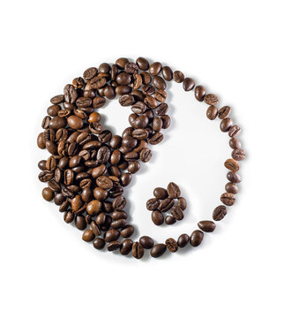 Yin and yang symbol made of coffee beans on white background