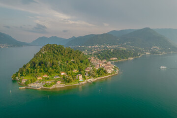 Fototapeta na wymiar Aerial view of Bellagio village in the evening. Bellagio is a picturesque and traditional village, located on the southern shore in peninsula of Lake Como, Italy