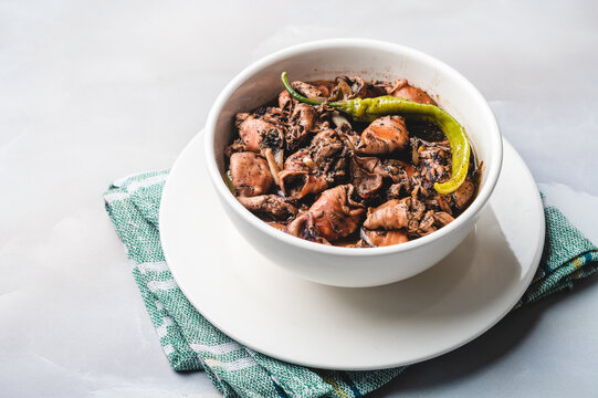 Adobong Pusit is a tasty squid dish cooked using the popular Filipino adobo method. 