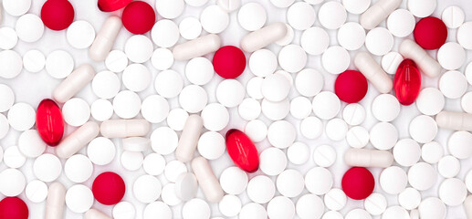 Pharmaceutical industry, healthcare and pharmacy top view on red and white vitamins, pills and capsules medicines scattered on white background, flat lay