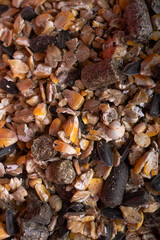 background of basical nutrition muesli  for  horses. feeding and horse care concept. macro. top view