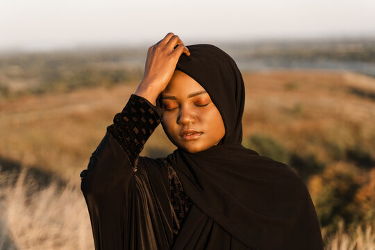 Portrait Of Muslim Woman In Black Robe.