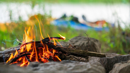 Campfire during a kayak tour on a river