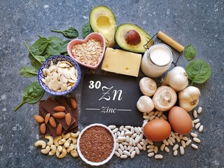 Food rich in zinc with the symbol Zn and atomic number 30. Natural products containing zinc, dietary fiber and vitamins. Healthy sources of zinc, healthy diet food. - obrazy, fototapety, plakaty