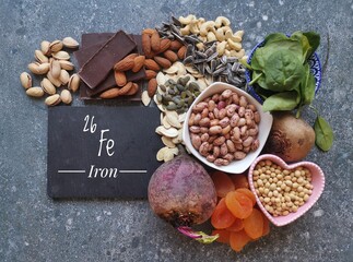 Vegan food rich in iron with symbol Fe and atomic number 26. Natural products containing iron,...