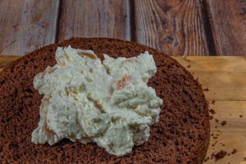 Baking of brown cream fruit cake with apricot and marijuana butter