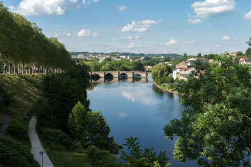 Fototapeta na wymiar Saint Etienne Bridge in Limoges City with clouds reflection
