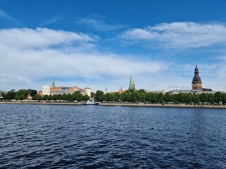 Naklejka premium Beautiful panorama from the side of the river to the Latvian capital Riga on a summer day 2021