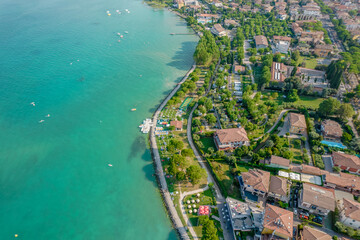 Aerial view of Sirmione resort coastline in Italy on the shore of Garda lake in Lombardy