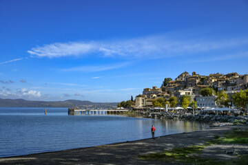 Fototapeta na wymiar Panoramic view of Anguillara Sabazia, a medieval town overlooking a lake in the province of Rome.