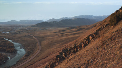 The flight of the copter along the mountain with red stones and the discovery of the wonderful landscape of the steppe valley. Very beautiful view of the territory with an interesting landscape. 