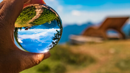 Crystal ball alpine landscape shot at the famous Rossbrand summit near Filzmoos, Salzburg, Austria