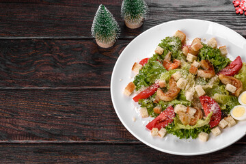 Tasty fresh salad prepared for the Christmas table