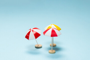 Yellow and red umbrella on a blue background.