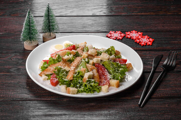 Tasty fresh salad prepared for the Christmas table