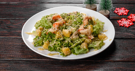 Tasty fresh salad prepared for the Christmas table