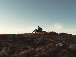 Female Hiker Resting on Top of the Mountain