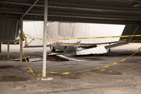 Metal Carport In The Parking Lot Has Collapsed Due To Strong Winds And Rain