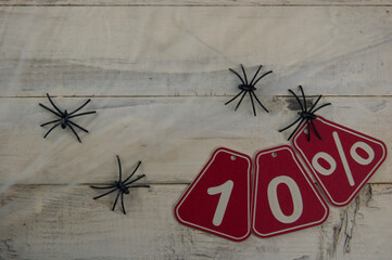ten percent discount on Halloween background - price tag on a rustic old wooden background