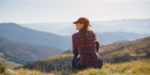 Female Hiker Resting on Top of the Mountain