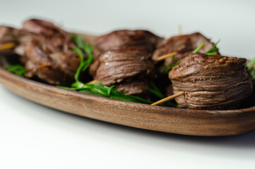 Fototapeta na wymiar Juicy beef, fried and cooked in the shape of a rose, creatively served meat
