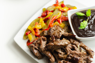 Beef strips with mixed peppers and mangetout served with black bean sauce