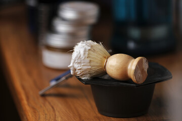 Set of shaving equipment and men's cosmetic products on wooden table, barbershop. shave concept...