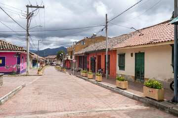 Fototapeta na wymiar Nemocon, Cundinamarca, Colombia. July 2, 2021: Colorful facade and architecture of city houses.