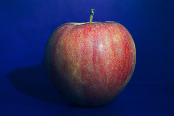 red apple on blue background