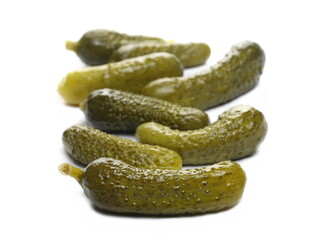 Pickled gherkin pile, pickles isolated on white background