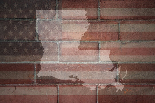 map of louisiana state on a painted flag of united states of america on a brick wall
