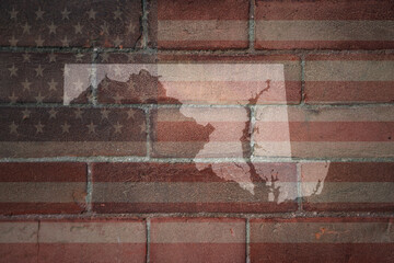 map of maryland state on a painted flag of united states of america on a brick wall