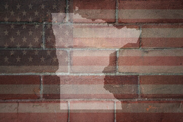 map of minnesota state on a painted flag of united states of america on a brick wall