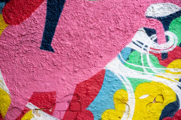 texture of concrete close up with colourful graffiti