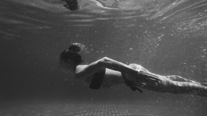 person in the water - obrazy, fototapety, plakaty